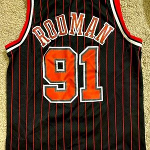 A medium Dennis Rodman Chicago Bulls jersey. In good condition.